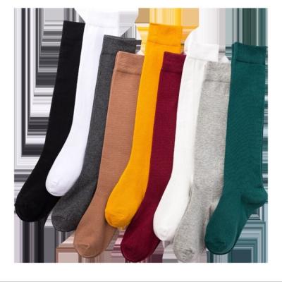 China QUICK DRY pure Japanese color cotton tube black tube JK pile medium socks 1 student socks for sale