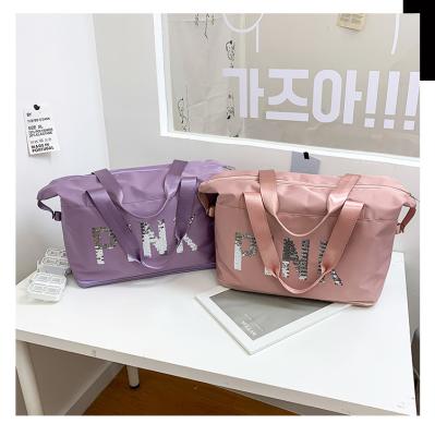 China Beautiful fashion women's fashion handbag pink sequin letter travel one large capacity wet and dry portable shoulder bag for sale