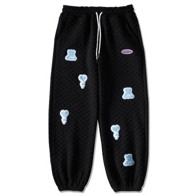 China New Style Waffle Joggers Pants Pockets Anti-static Drawstring Men's Casual Pants Waffle Logo Embroidered Jogging Sweatpants for sale