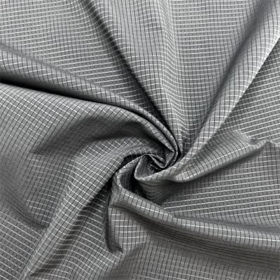 China 75D Low Elasticity T400 Hollow Grid Fabric 100% Recycled Polyester Perforated Grid Pattern for sale