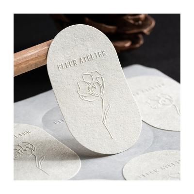 China Waterproof Embossed Sticker Florist Custom Rough Colorless Logo Embossed Custom Dessert Sticker Custom for sale