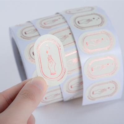 China Custom Paper Waterproof Logo Printing Label Sticker, Rose Gold Foil Sticker Printing Logo Sticker Roll Oval for sale