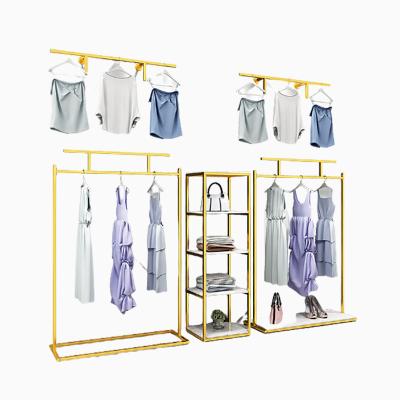 China Clothes shop women custom workshop standing size clothes display racks fashion garment displays metal rack clothing store rack display for sale