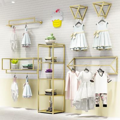 China Clothes shop clothing store display racks women's clothing store display rack gold children's clothing fabric floor rack hanger for sale