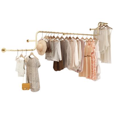 China Clothes Shop High-end Women Shop Stainless Steel Cloth Dress Rack Rack Metal Wall Display Mounted Hanger On Wall for sale