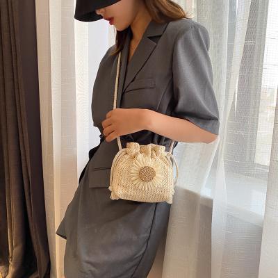 China Fashion Women Beach Straw Bags Classic Texture Sunflower Drawstring Woven Bucket Cross - Body Shoulder Bag for sale