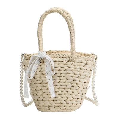 China 2021 New Vintage Autumn and Winter Series Beach Handbag Straw Bag Holiday Pearl Shoulder Handmade Bucket Bag for sale