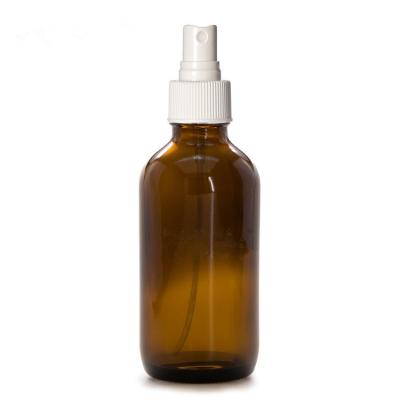 China Boston Cosmetic Wholesale Amber Round Spray Glass Bottle 60ml With Plastic Sprayer For Cosmetic for sale