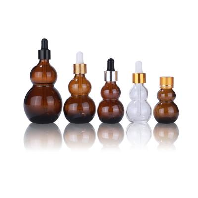 China 10ml 20ml 50ml 100ml Bottle Gourds Essential Oil Dropper Bottle Cosmetic Amber Glass Medicine Bottle for sale