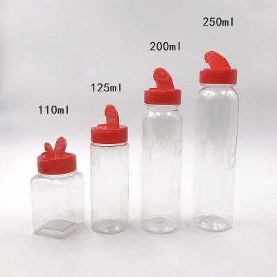 China Wholesale Kitchen Spice Jars Powder and Salt Bottle Pepper Chilli Shaker Garlic Spice Plastic Bottle With Lid Customized for sale