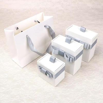 China Paper Packaging Boxes White Empty Jewelry Gift Boxes With Bow for sale