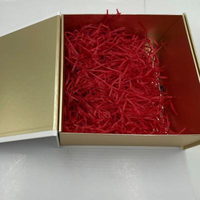 China Printed Logo Cosmetic Box Packaging Folding Cosmetic Box With Raffia Insert for sale