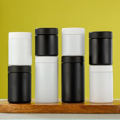 China Logo/Graphic Design Borosilicate Glass Round Storage Jars with Childproof Cap in Black Matte and White Matte for sale