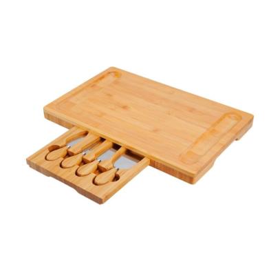 China Sustainable Kitchen Charcuterie Wooden Tray Serving Tray Cutting Board Bamboo Cheese Board with Slide-out Drawer for sale