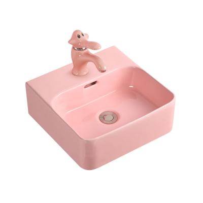 China Hot Chaozhou Sanitary Ware Design Hans Lavatory Sink Simple Design Pink Color Ceramic Wash Basin For Children for sale