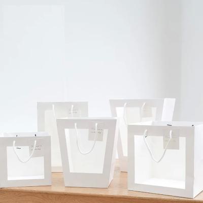 China Net celebrity window transparent tote bag flower shop bouquet packaging gift bag birthday open window paper bag for sale