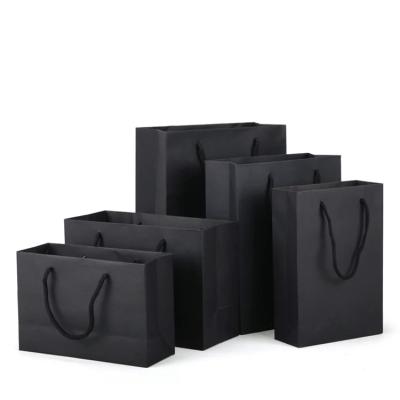 China Custom Cheap Luxury Branded Cloth Shopping Foldable Reusable Flat Black Craft Paper Bag for sale