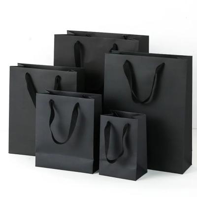 China Custom Black Luxury Packaging Shopping Bags Logo Printed Sac Rope Handles Matte Black Gift Paper Retail Product Bag for sale