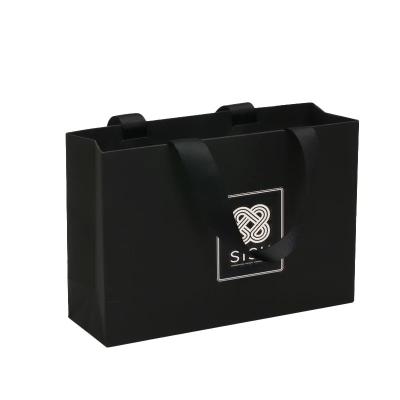 China Bolsas de compras personalizadas Roupas de luxo Papel Kraft Marrom Regalo Bolsa de Papel Grande Boutique para Logotipo Bolsa de Manuseio de Faixa à venda