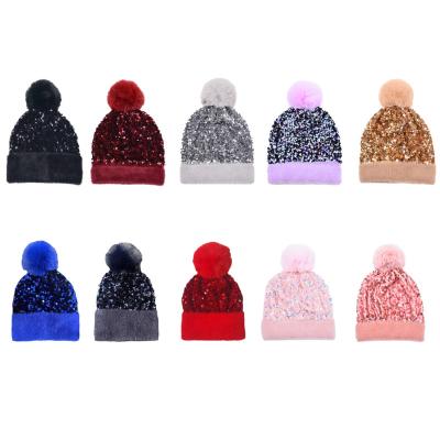 China JOINT high quality fashion autumn winter warm sequin women knitted pom pom beanie hats for sale