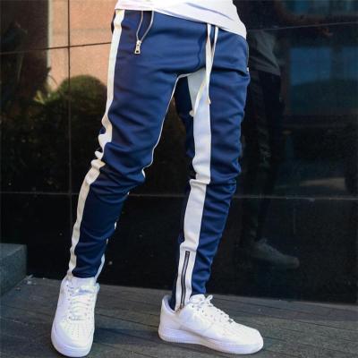 China Anti-wrinkle free sample 2021 summer new pocket zipper sports double striped pants zipper sports pants new men's casual pants jogging pants for sale