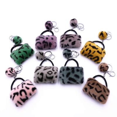 China HOT SALE Unisex Fuzzy Ball Pom Pom Keychain Cute Plush Cartoon Car Key Ring Leopard Dangling Copy for sale