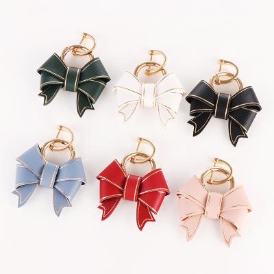 China Promotion Gift Wholesale Fashion Multicolor Decoration/PU Leather Bow Car Handbag Key Ring Pendant Key Chain For Women for sale