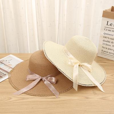 China Foldable And Easy To Wear New Design Big Earflaps Bow Oversized Summer Hollow Straw Beach Hat for sale