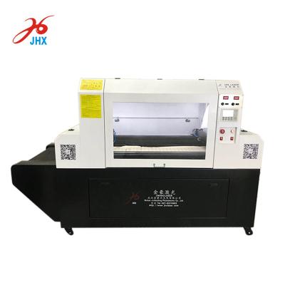 China Full-enclosed automatic lace laser cutting machine for warp knitted curtain, tablecloth, under wear for sale