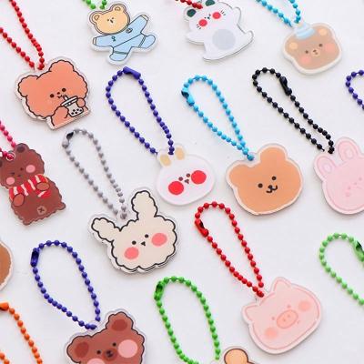 China Customized Cartoon Acrylic Key Chain Ins Bear Pearl Chain Bag Accessories Korean Cute Key Chain Color for sale