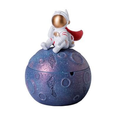 China Modern Tabletop Portable Astronaut Planet Easy Clean Resin Creative Ashtray Cigarette Ashtray Resin Figurines for sale