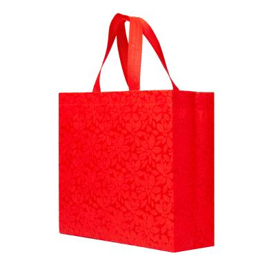 China Eco-friendly Promotional Custom Logo Laminated Waterproof Non Woven Gift Bag For Kids Birthday Gift Carry for sale