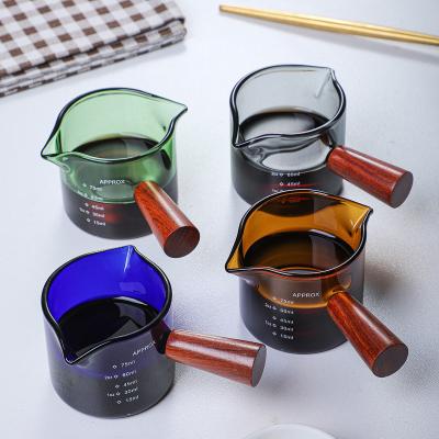 China Colored Glass Tumbler With Wooden Handle Double Mouth Milk Cup Espresso Coffee Cup Measuring Cup for sale