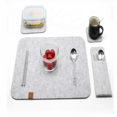 China Premium Felt Table Sustainable With Christmas Felt Coasters Felt Place Mats Set With Cutlery Pockets for sale