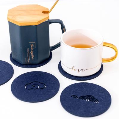 China Sustainable Hot Sale Simple Design Round Drink Absorbent Felt Coasters With Stand Felt Round Coaster for sale