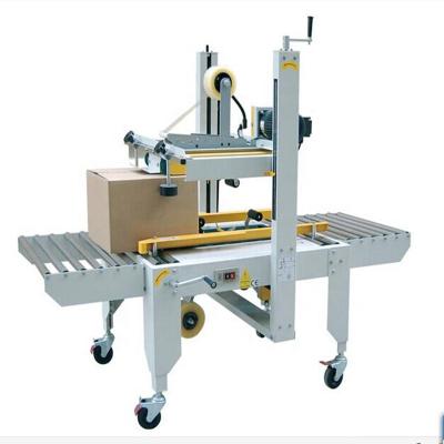 China Food Carton Sealing Machine FXJ6050 Adhesive Tape Carton Sealer Machine for sale