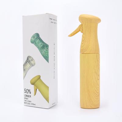 China Customaziton logo colour wood grain spray bottle 300ml PET plastic water bottles for sale