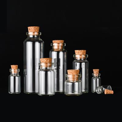 China Small Bottles Empty Sample Vials Clear Glass Bottles With Corks Jars Te koop