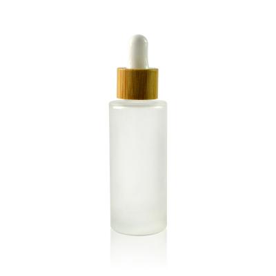 Chine Essential oil 5ml 10ml 15ml 20ml 30ml 50ml 100ml frosted glass dropper bottle with bamboo cap à vendre