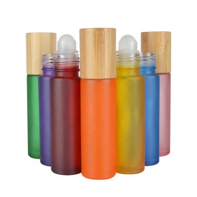 Chine Hot sale essential oil luxury 10ml clear pink black green blue roll on glass bottle with bamboo cap à vendre