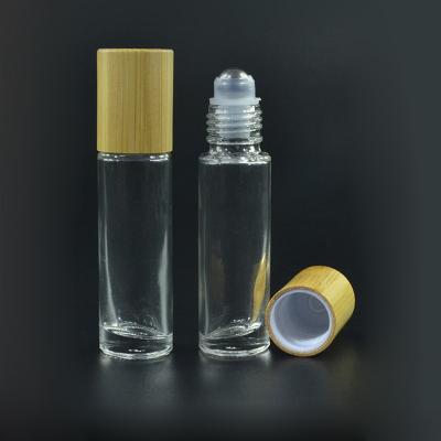 Chine hot sale 10ml 15ml bamboo roll on glass bottle with bamboo lid for essential oil and perfume à vendre