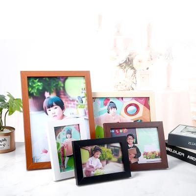 China Creative Customized Wooden A4 Photo Frame Brown A4 Photo Certificate Frame For Wall Table Display for sale