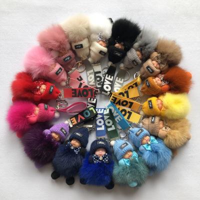 China Real Fox Tassel Lovely Angel Baby Metal Keyrings Handbag Car Key Rings Colorful Acrylic Dangle Fur Gift Key Chain For Women Kids for sale