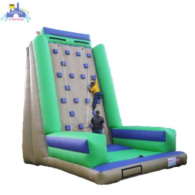 China Lilytoys Durable 0.55-0.6mm PVC Tarpaulin Adult Inflatable Mobile Rock Climbing Wall With Mattress And Safety Belt Climbing Wall Slide For Sale for sale