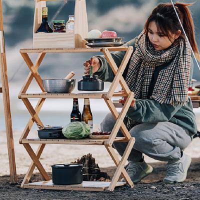 China AMOYCN Eco-friendly Outdoor Portable Camping Solid Wood Shelving Four Folding Table Floors Picnic Storage for sale