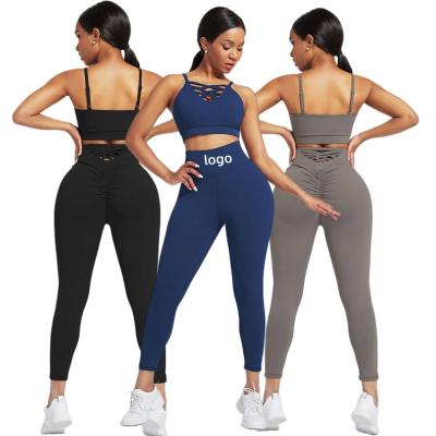 China Breathable Quick Dry Slimming 2 Piece Set Criss Cross Bra And Hi-Waist Leggings Sports Workout Straps Yoga Clothes for sale