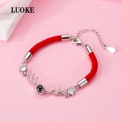 China Beautiful FASHIONABLE Red Rope Zirco Antlers Couple Bracelet Red Rope Antlers Simple Woven Zircon Bracelet for sale