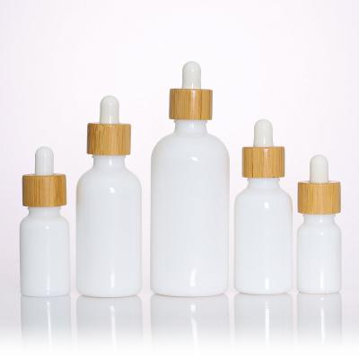 China Dropper Cap 30ml 50ml 100ml Porcelain Essential Oil Cosmetic Packaging Serum Bamboo White Cosmetic Container for sale