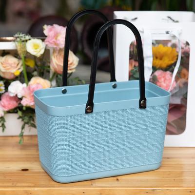 China New Design Sustainable Hand Hold PP Plastic Canvas Pattern Modern Simple Sundries Storage Basket for sale