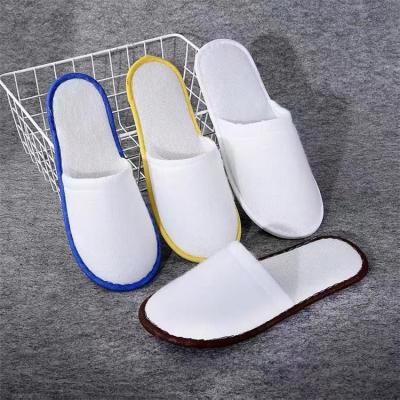 China Disposable Coral Fleece Luxury Spa Hotel Slippers Logo Hotel Slippers Non-Woven Terry Cloth Lightweight Custom Hotel Disposable Slippers for sale